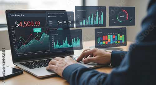 Person analyzing financial data on laptop with multiple graphs in office