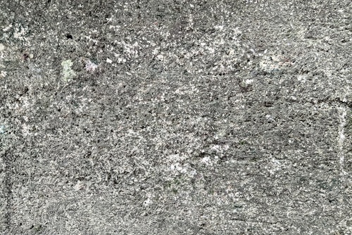 Картината върху платно Rough concrete wall texture background with weathered and pitted surface