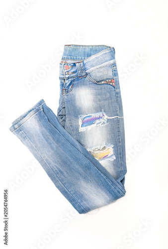 Women's blue skinny acid wash jeans on a white background