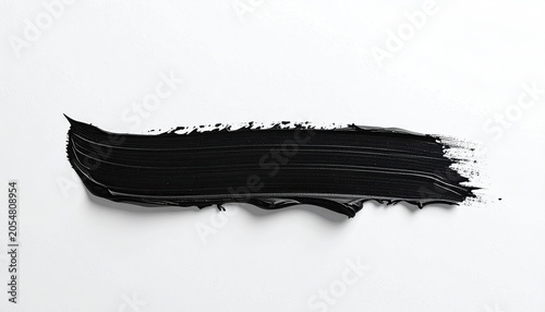 Bold black brushstroke texture against a crisp white surface