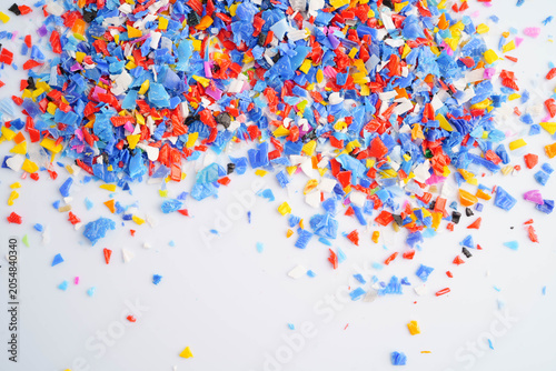 Tableau sur toile Plastic colorful pieces recycling shredded for industrial use.