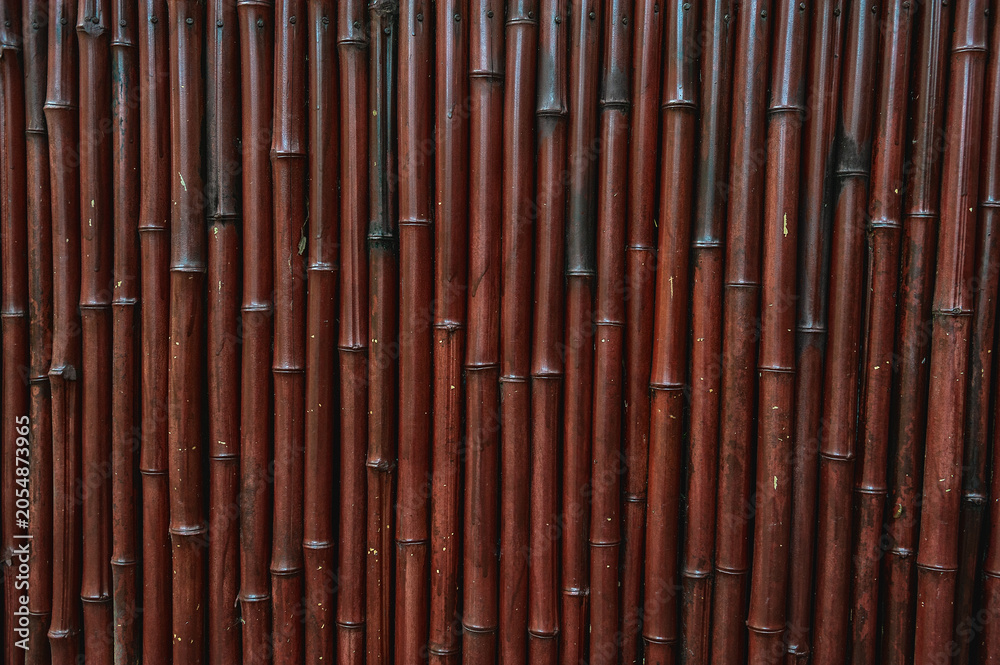 Fototapeta premium Bamboo texture forms a rustic natural background with brown tones