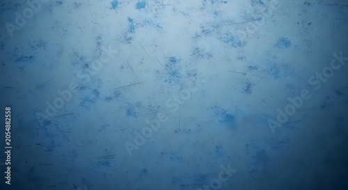 Abstract blue background with grunge texture, scratches and distressed surface effect dark blue vintage backdrop with weathered pattern for design, overlay, or wallpaper