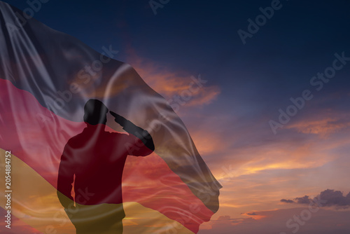 Valokuva Silhouette of military mans and National flag of Germany