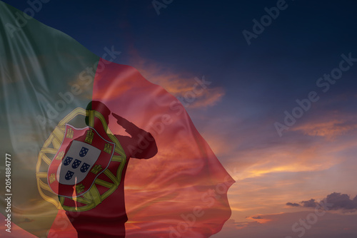 Obraz na plátně Silhouette of military mans and National flag of Portugal