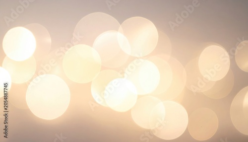 Soft focus image of glowing orbs, creating a warm, ethereal effect with varying sizes and luminosity, hinting at celebration