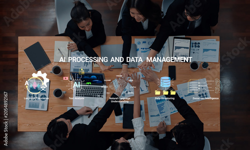 Foto Team Collaborating on AI Processing and Data Management Techniques with Technology and Analysis Tools in a Modern Office Setting Haptic