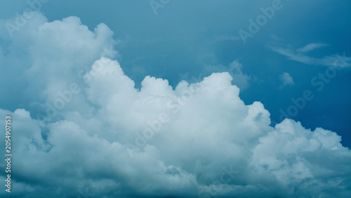 The sky, clouds, changing weather in the blue sky, plumes of smoke gathering into abstract clouds.