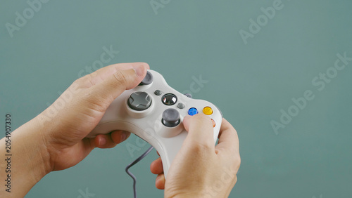 Playing games with a joystick, relaxing, happy, and fun at home. Planning and enjoyment.