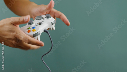 Playing games with a joystick, relaxing, happy, and fun at home. Planning and enjoyment.