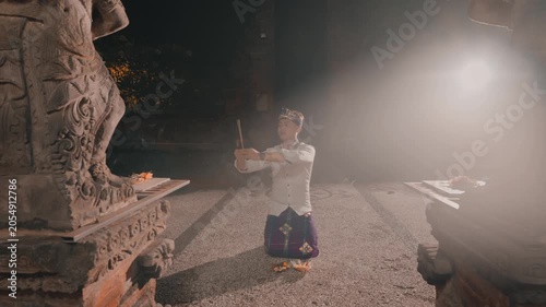 Spiritual Moment of Man Praying with Smoke