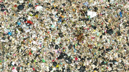 Tableau sur toile Drone shot above scattered mixed waste illustrating severe pollution, harmful environmental impact, excessive consumption habits, weak waste handling, and low sustainability awareness