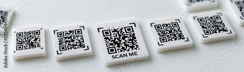 QR Codes Scattered on White...