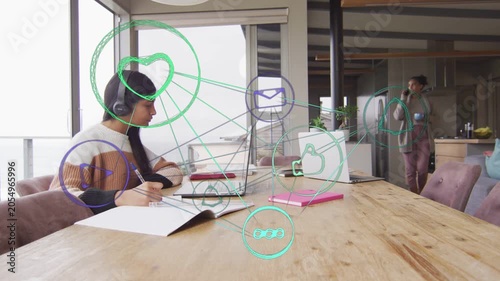 Student studying notes at desk, mom taking phone call, animated social media icons linking PC