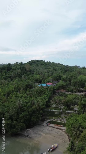 Aerial drone view of a luxury resort at Weh island, Sabang Indonesia. featuring overwater bungalows and turquoise waters. Tropical island in Aceh, Sumatera.