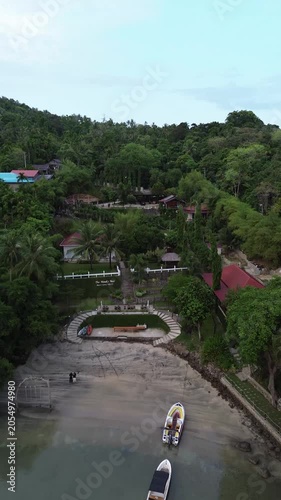 Aerial drone view of a luxury resort at Weh island, Sabang Indonesia. featuring overwater bungalows and turquoise waters. Tropical island in Aceh, Sumatera.