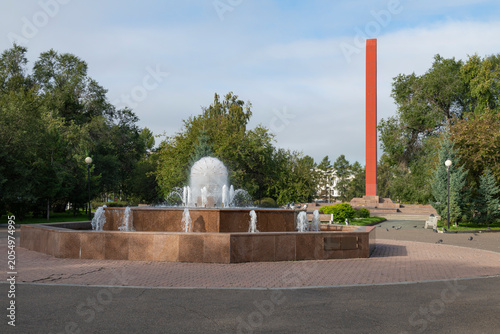 фотографія City fountain on the Red Square on a September day. Krasnoyarsk