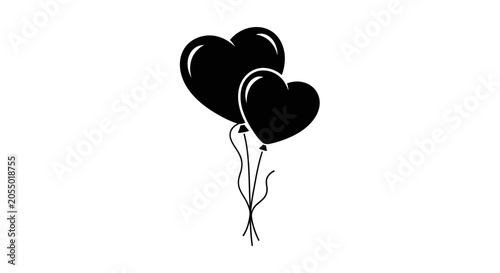 Konstfotografi Two black heart shaped balloons floating together tied with ribbons on a white b