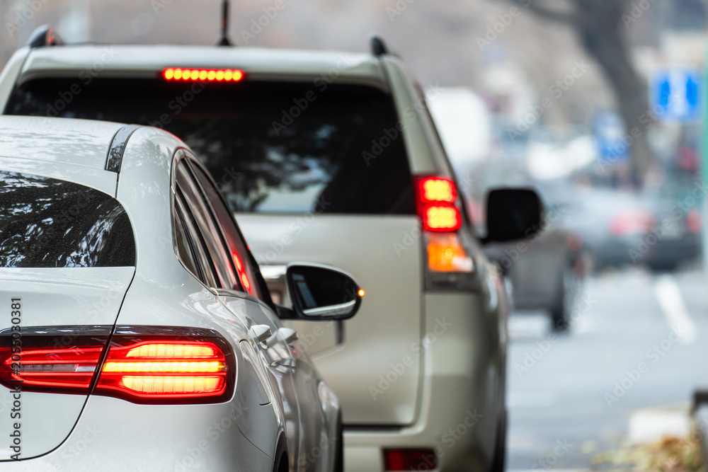 Naklejka premium A traffic jam with vehicles congested on the road, causing delays, slow movement, and urban congestion, highlighting transportation challenges and city planning needs.