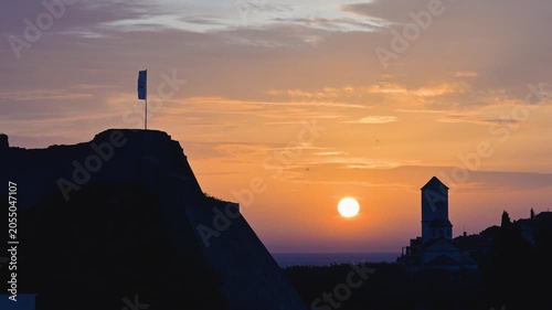 Scenic sunset over the silhouette of Ulcinj, Montenegro