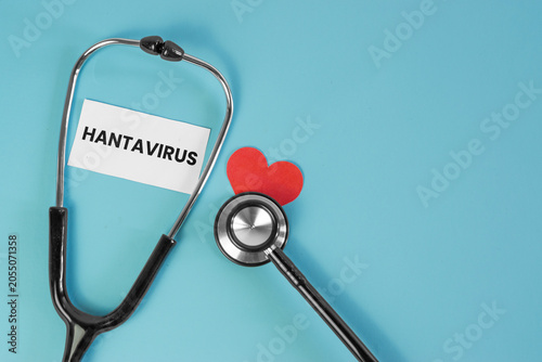 фотографія Hantavirus Medical Concept with Stethoscope and Heart Symbol on Blue Background