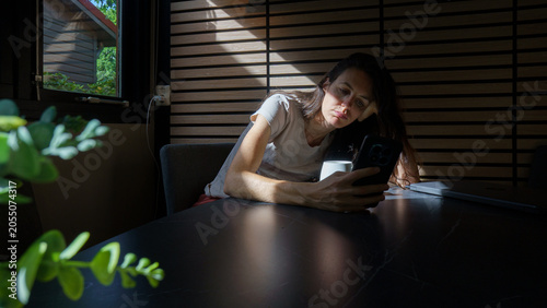 Bild auf Leinwand Woman experiencing burnout while working remotely at home