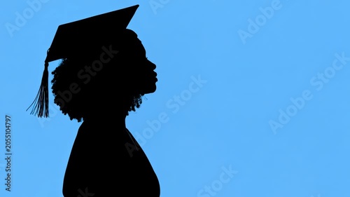 Graduate silhouette wearing cap against blue background celebrating achievement