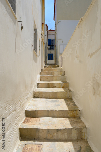Narrow street of the town of Chora. Andros Island, Cyclades, Greece