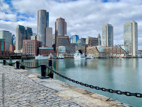 Boston’s waterfront skyline rises above the harbor with yachts, historic wharves, and modern skyscrapers. A classic view of the city’s maritime and financial district.