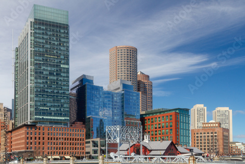 Historic waterfront structures and modern skyscrapers define the Boston Harbor skyline, blending maritime heritage with contemporary urban architecture.