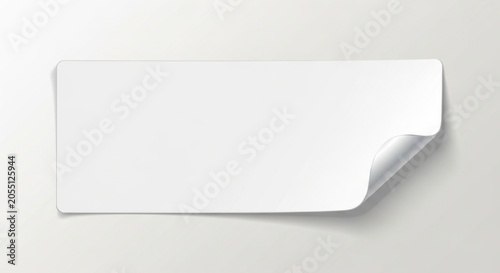 Blank white paper sticker with curled corner.