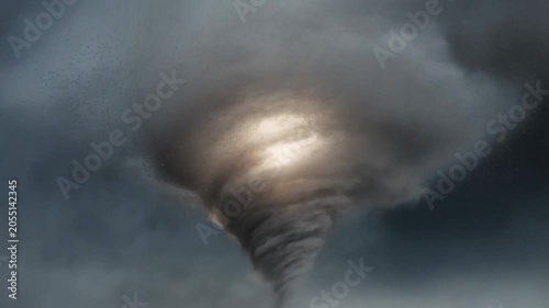 Intense spiraling tornado with powerful wind and dark clouds in dramatic motion