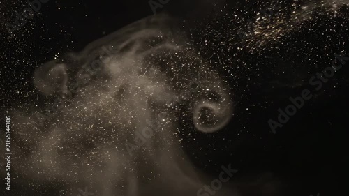 Golden particles and swirling smoke blend together in a mesmerizing display against a dark background, creating an enchanting visual effect of movement and light