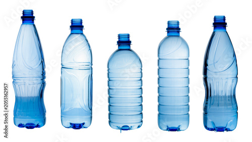 Isolated empty plastic water bottles without caps showing various shapes and designs on display