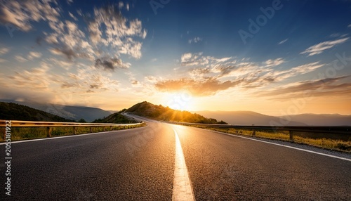 Long Empty Mountain Road Under A Bright Sunset On A Sunny Summer Day With A Speed Motion Blur Effect Ideal For A Copy Space Image