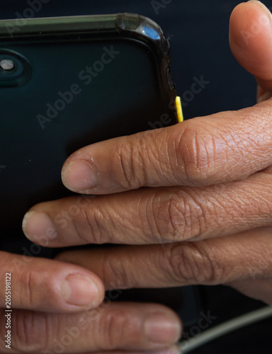 a woman's hand holding a cell phone
