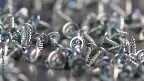 Metal screws for fastening equipment. Soft focus. Close-up. 