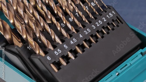 A set of drills for drilling metal in a plastic case.