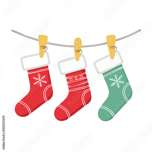Three Christmas stockings hanging on a clothesline