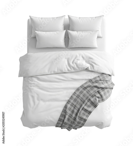 Top-down view of a made bed with white duvet, multiple pillows and a draped gray plaid throw, styled for a minimal, cozy bedroom aesthetic