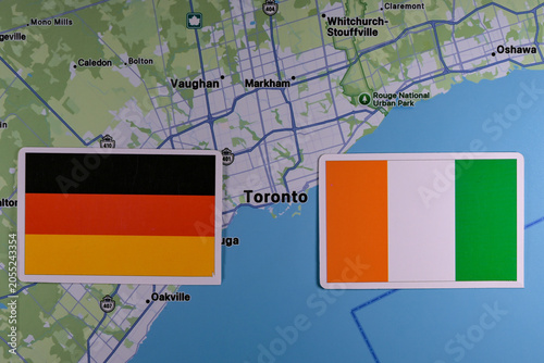 June 9, 2026, United States. Flags of the participants of the FIFA World Cup group stage of the national teams of Germany and Côte d'Ivoire on the background of the map of Toronto.