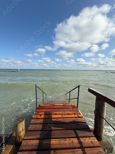 wooden staircase into the sea at the bathing beach during a seaside holiday