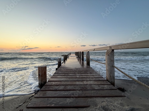 pier on the beach in summer 