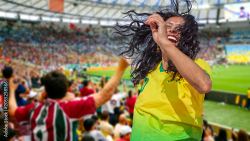 Quadro em tela A passionate Brazilian soccer fan celebrates a goal in a stadium, wearing a yellow jersey