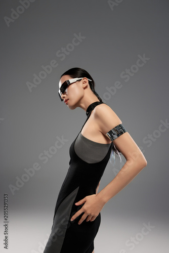 Futuristic Fashion Model in Black Dress and Visor