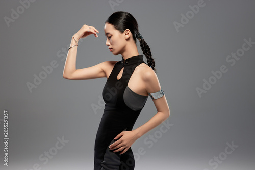 Futuristic Fashion Woman in Black Dress Posing