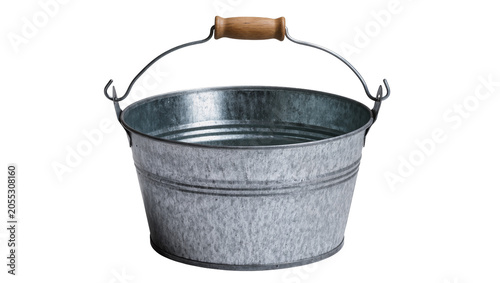 Fotografie Isolated rustic galvanized metal bucket with a natural wood handle, old silver p