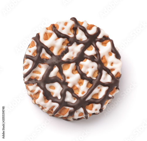 Top view of frosting drizzled round cookie
