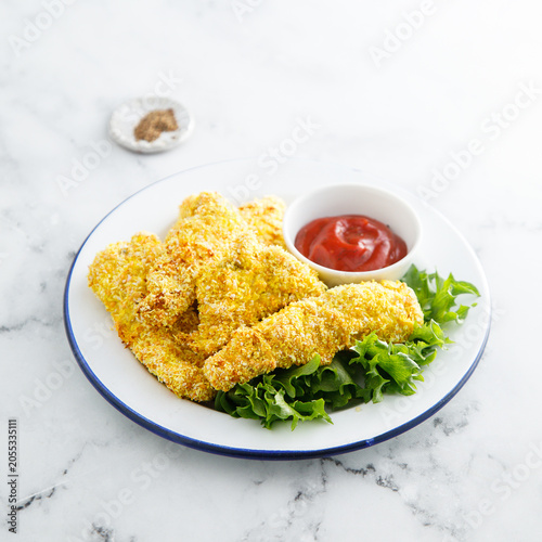Chicken stipes with tomato sauce