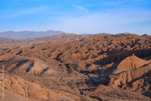 Scenic view of the Tiger Mountains badlands in Kazakhstan. Arid landscape with copy space suitable for travel, tourism marketing, and nature background concepts.